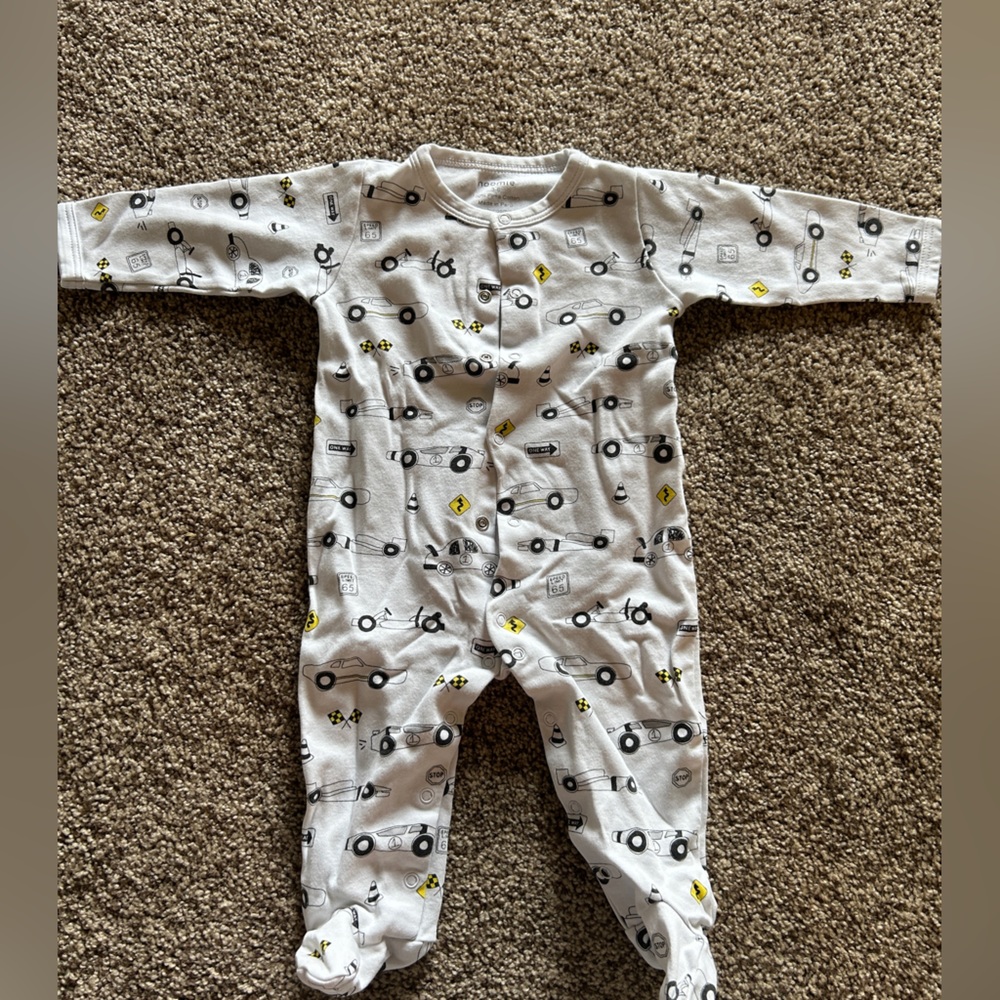 Set of four (4). Assortment of footed onesies.
